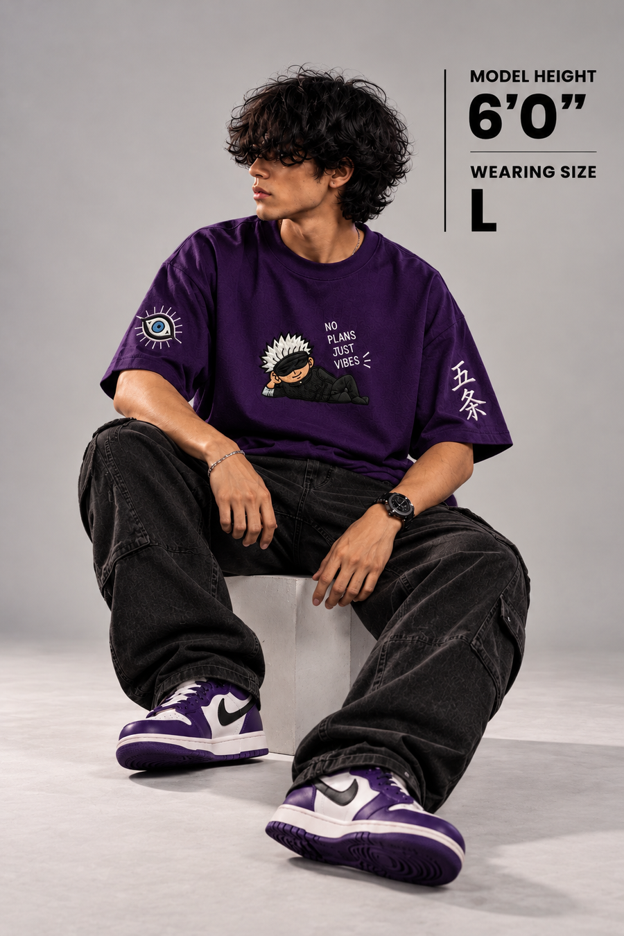 No Plans Just Vibes purple oversized T-shirt seated model, illustrative sizing