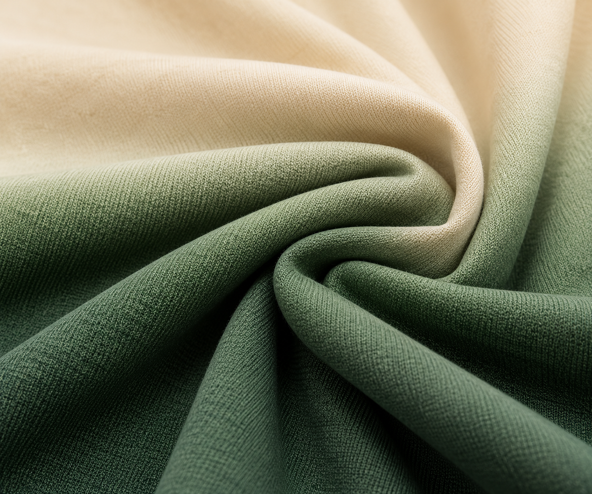 Smooth cream-to-olive poly-spandex sublimated fabric close-up