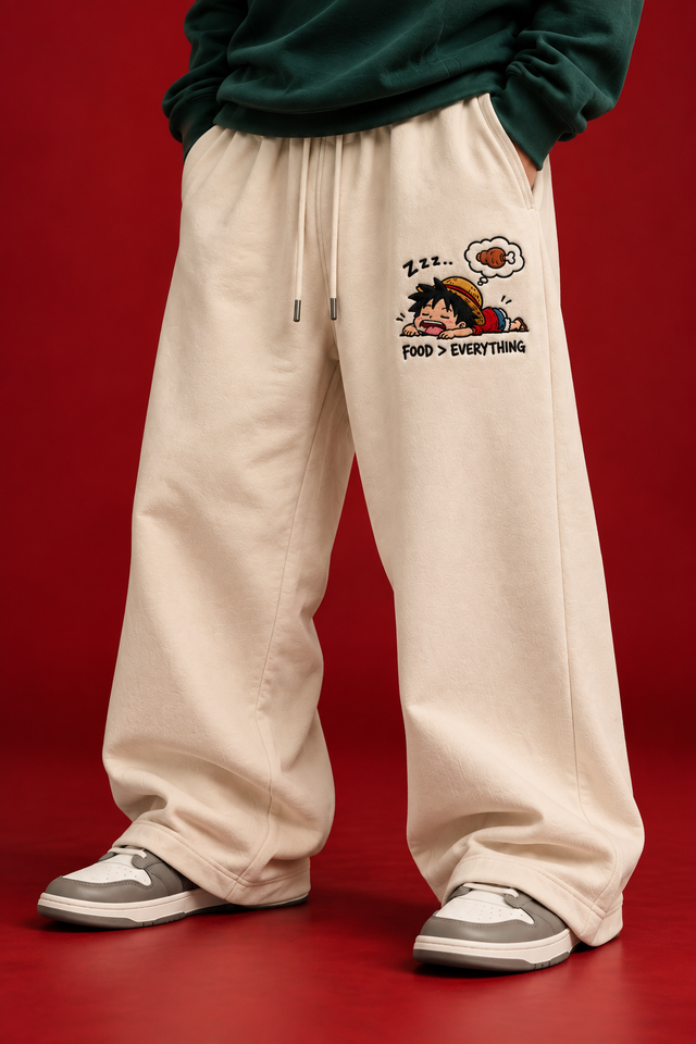 Cream anime embroidered sweatpants front