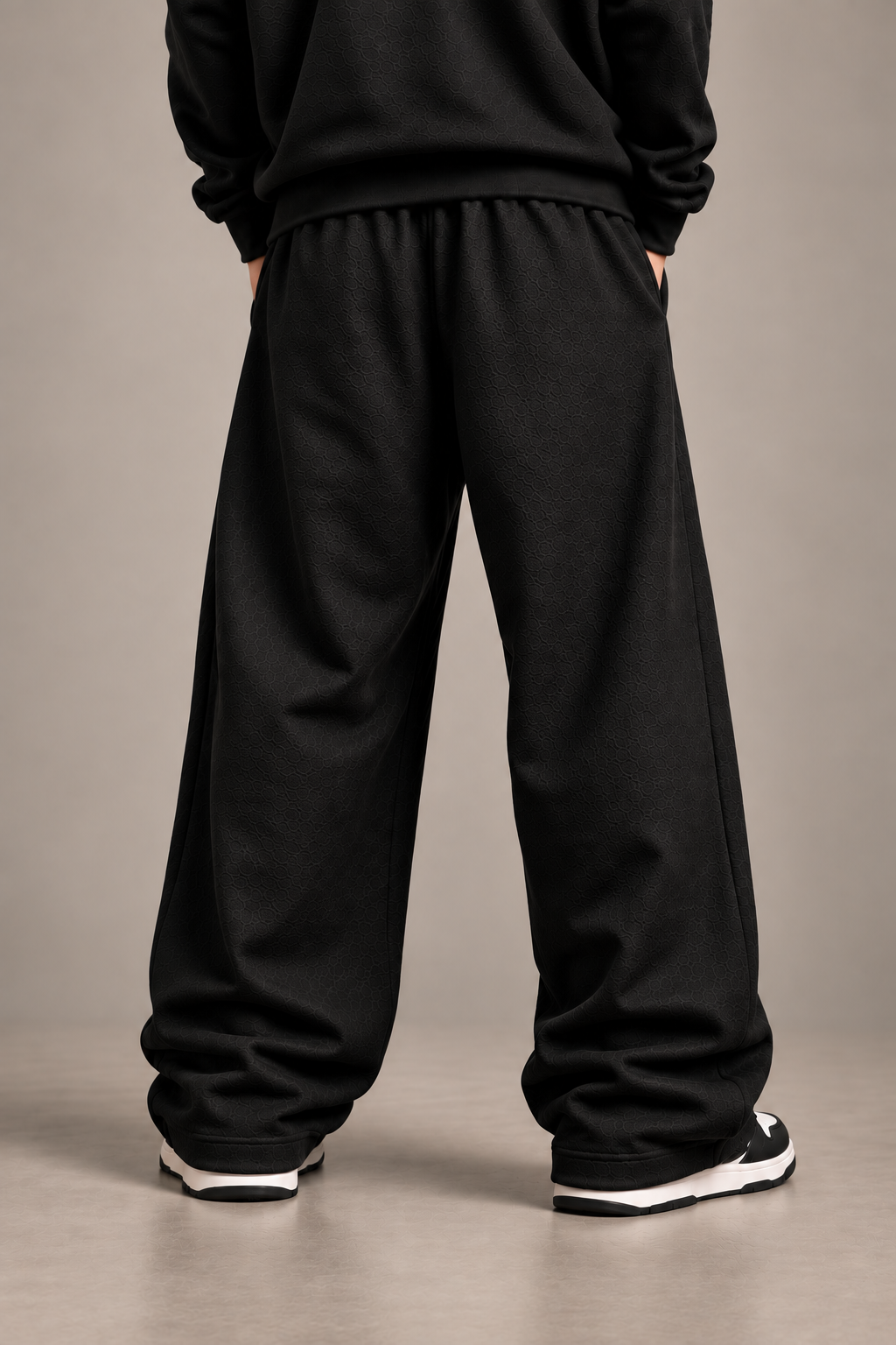 Black anime embroidered sweatpants back studio shot